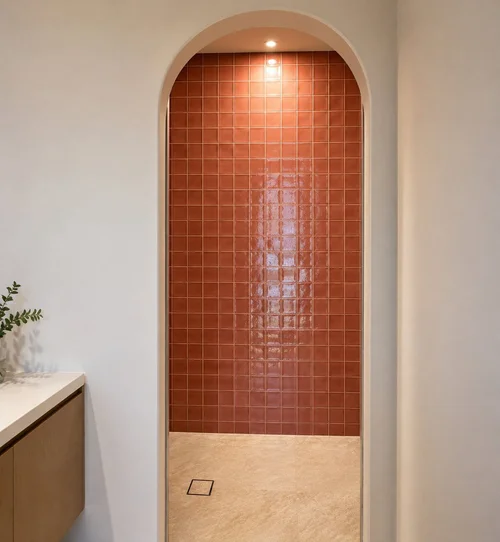 Custom feature tile finish around bathroom arch