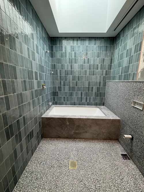 Bathroom feature wall tiling by Paiva Tiling Co