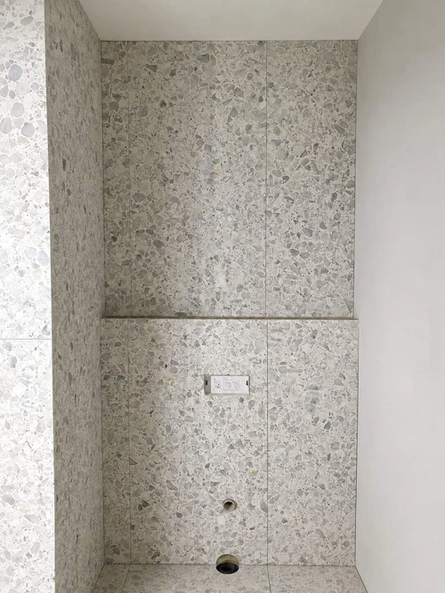 1200x600 terrazzo toilet wall tiling by Paiva Tiling Co