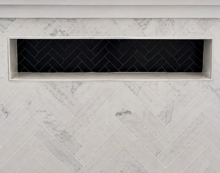 Herringbone mosaic niche tiling