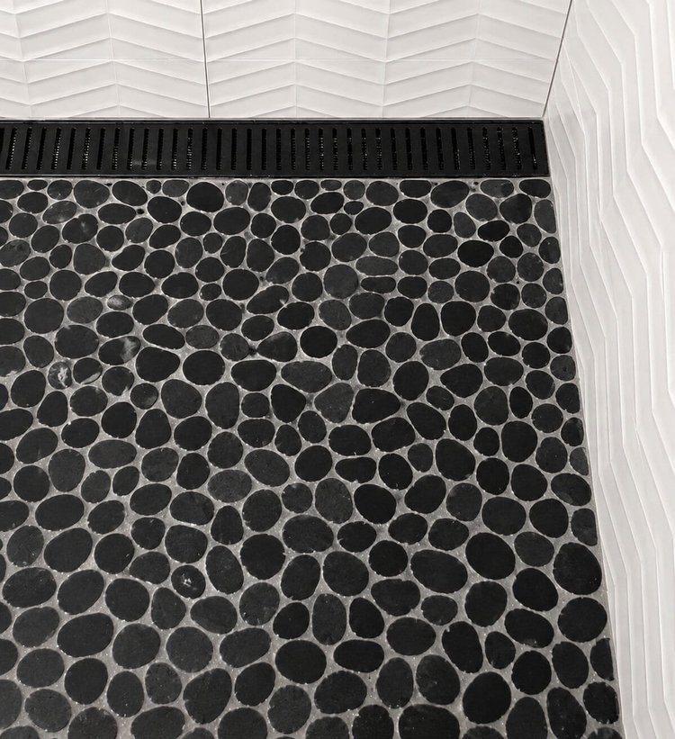 Pebble mosaic shower floor