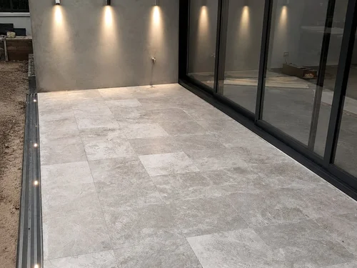 600x600 natural stone floor tiling by Paiva Tiling Co