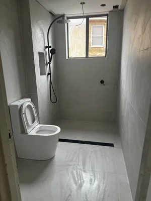 Large format bathroom tile installation by Paiva Tiling Co