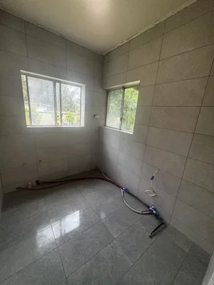 Large format bathroom wall and floor tiling by Paiva Tiling Co