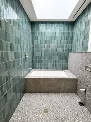 Green subway tile bathroom installation by Paiva Tiling Co