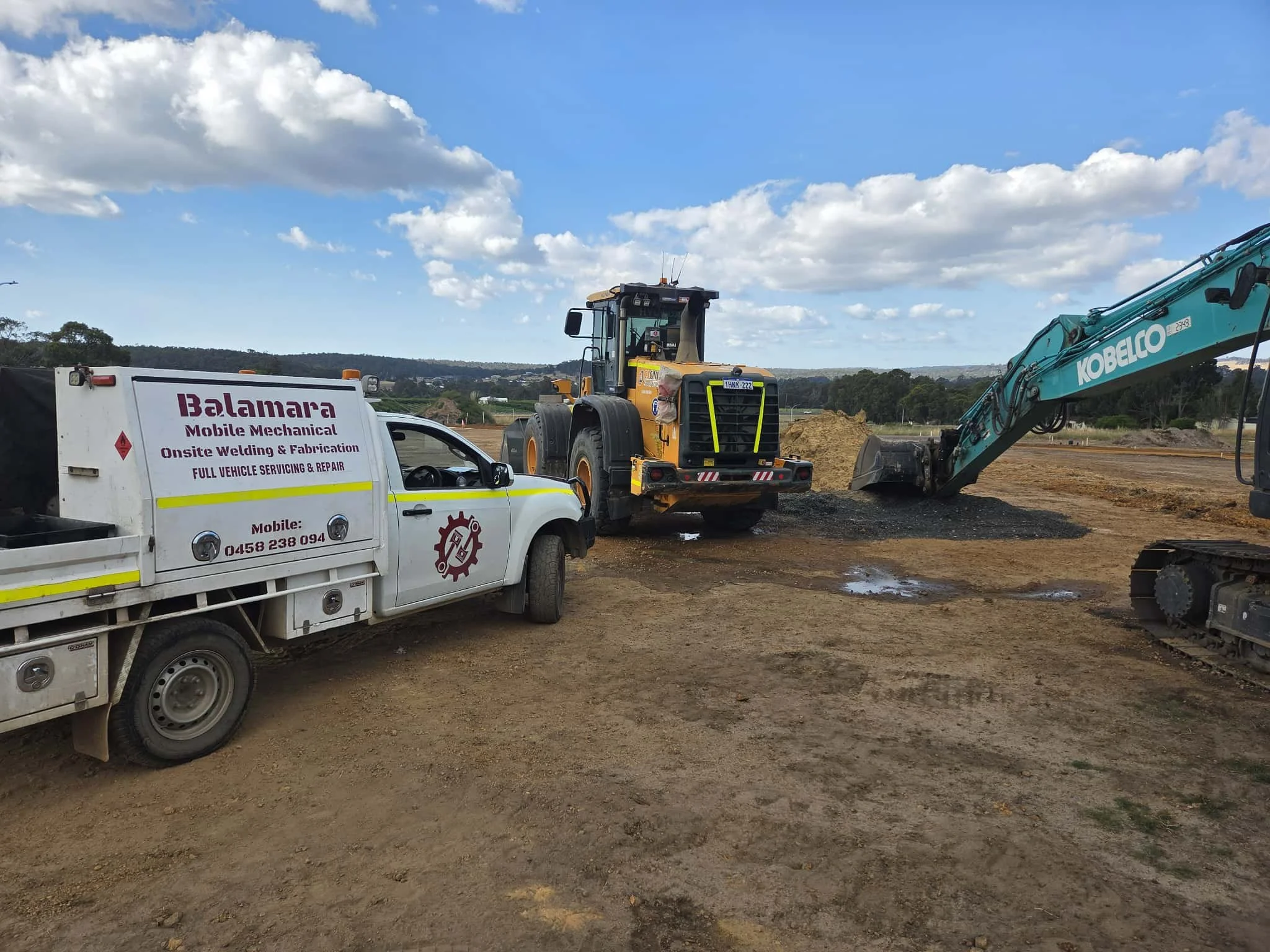 Balamara service ute in the foreground with some heavy machinery in the background