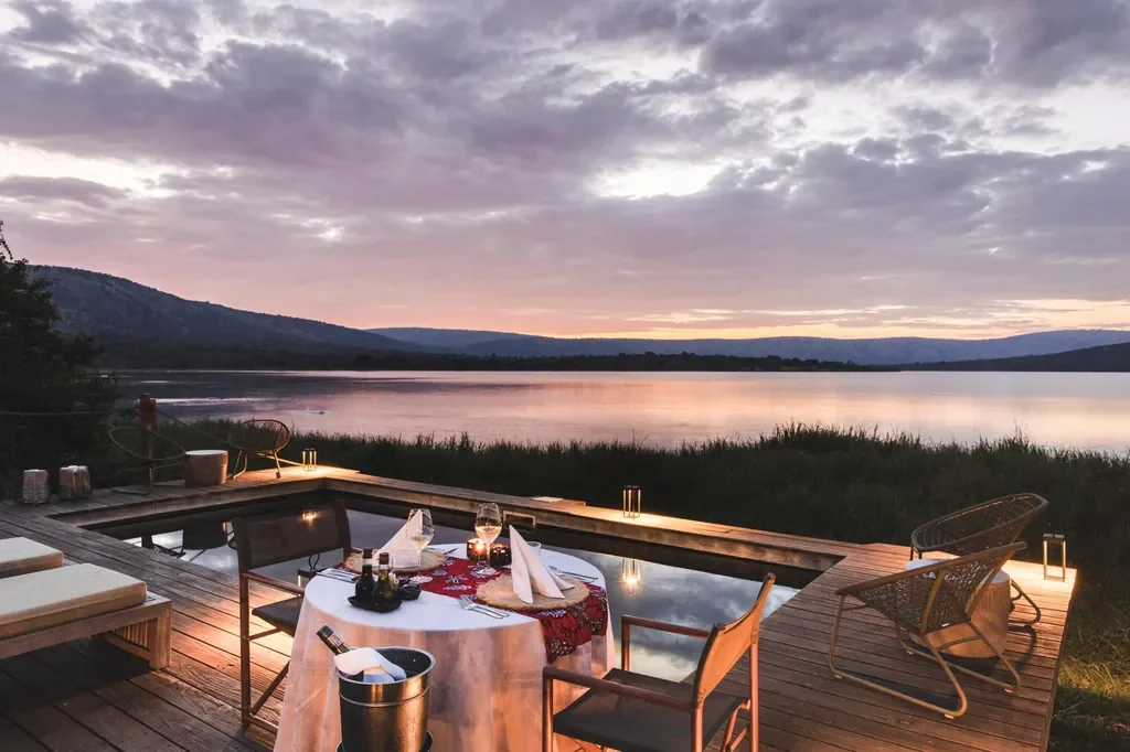 Romantic private dinner on deck with plunge pool at Magashi Camp, Akagera Rwanda