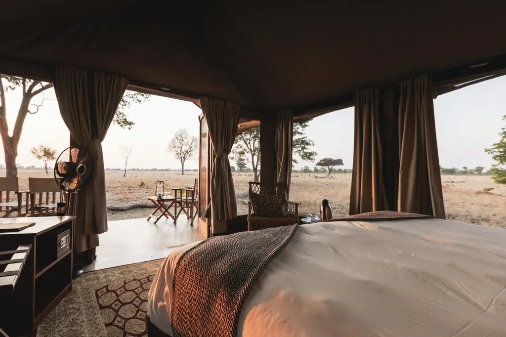 Davison's Camp tent interior with wide savannah views, Hwange National Park Zimbabwe, open canvas suite