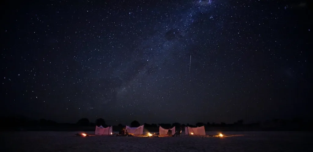Campfire at sleepout on the Luwi riverbed near Nsolo Bush Camp, South Luangwa National Park, Zambia