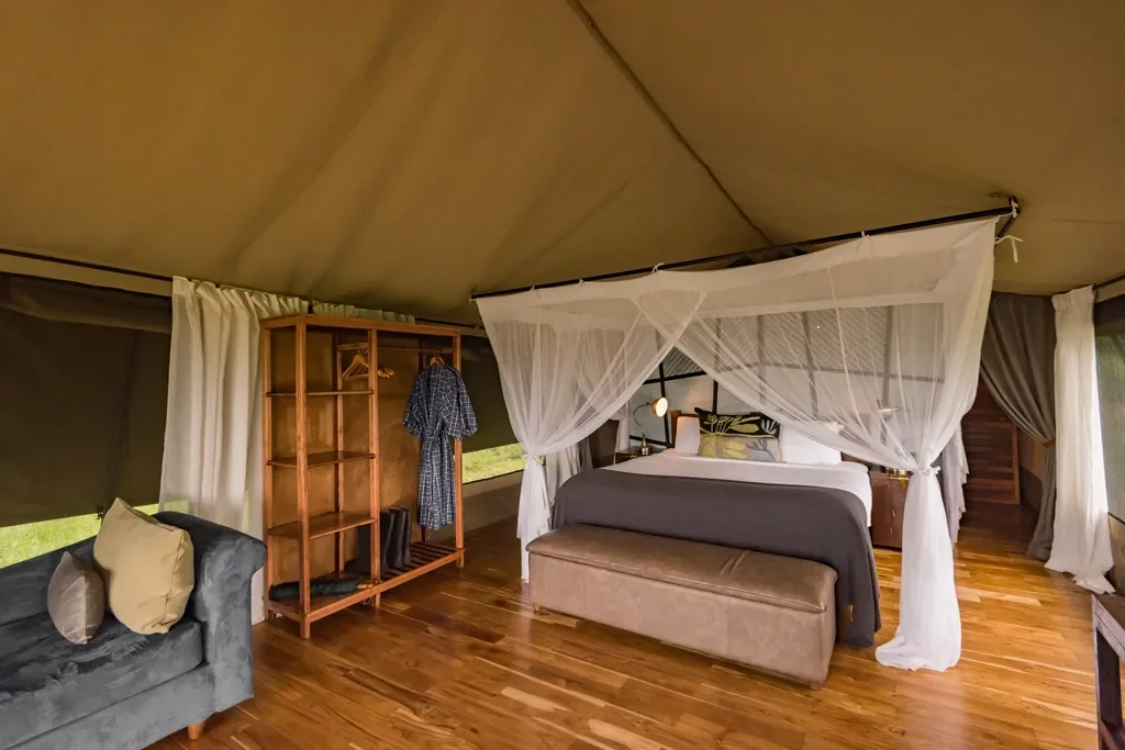Dunia Camp double tent with canopy bed and hardwood floors, Serengeti Tanzania