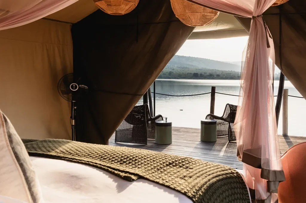 Inside Magashi luxury tent facing private deck and Lake Rwanyakazinga, Akagera National Park Rwanda