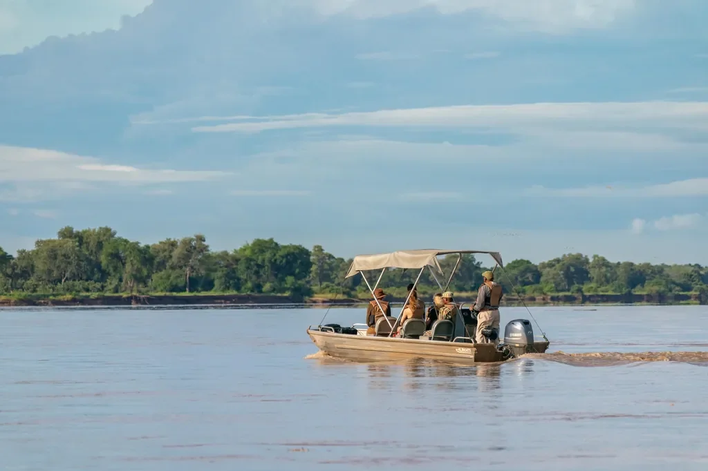 Seasonal boat safari on the Luangwa River near Nsolo Bush Camp, South Luangwa, Zambia