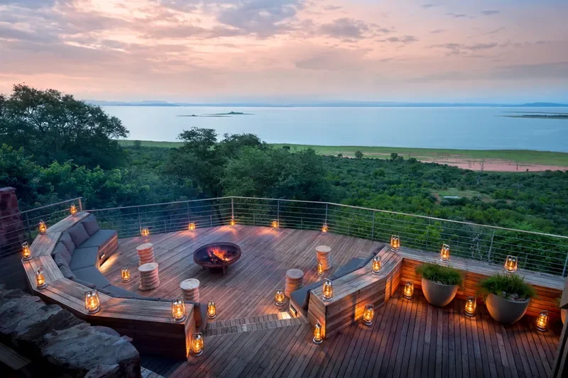 bumi-hills-lake-kariba-zimbabwe-sunset-fire-pit-deck-with-panoramic-lake-kariba-views-at-bumi-hills-safari-lodge-800w.webp