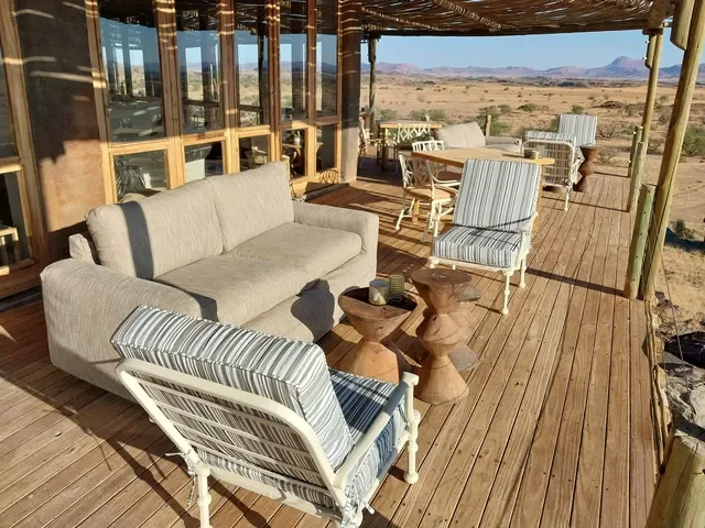Doro Nawas deck lounge with shaded pergola overlooking the Huab River valley, Damaraland