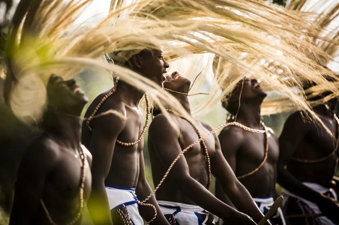 Traditional Rwandan Intore dancers in motion near Bisate Lodge