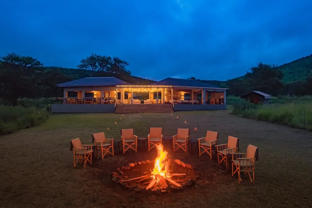Dunia Camp firepit circle in front of the main tented lounge, Serengeti Tanzania