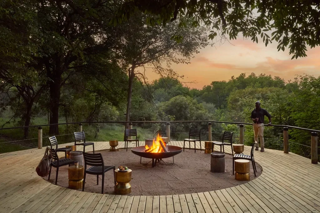Circular fire deck at Lion Sands Tinga Lodge at sunrise, Kruger safari lodge