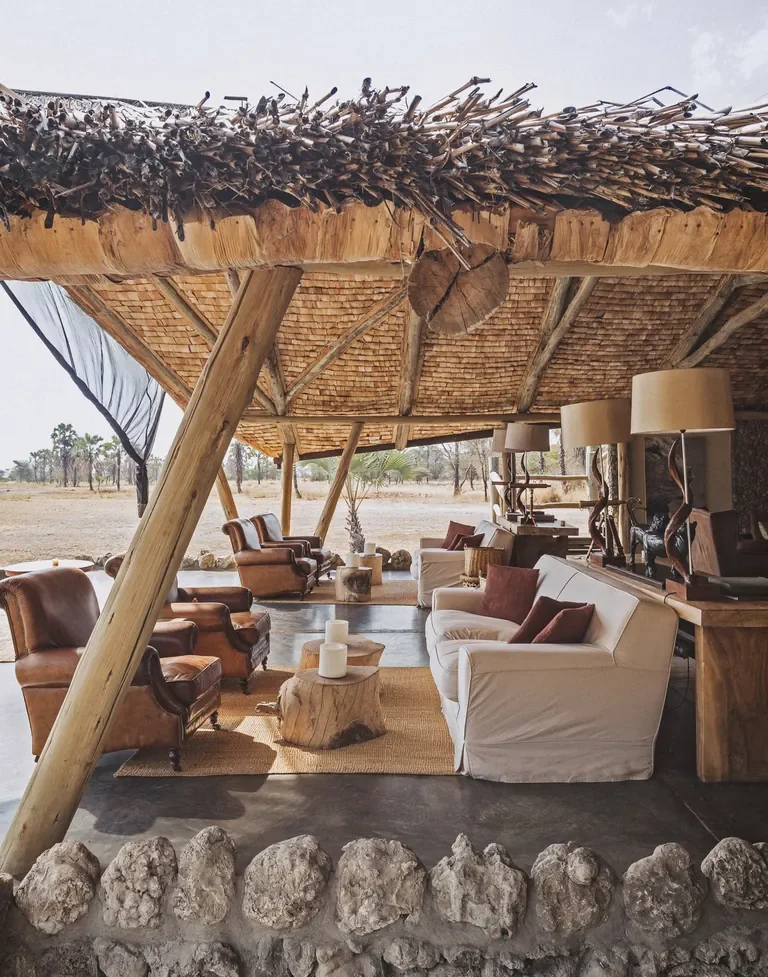 Chem Chem Lodge lounge area with natural wood design, open sided safari living in Tanzania