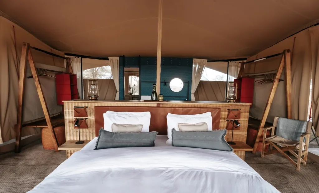 Front view of Usawa tent bedroom layout with divider and canvas wardrobes in Serengeti