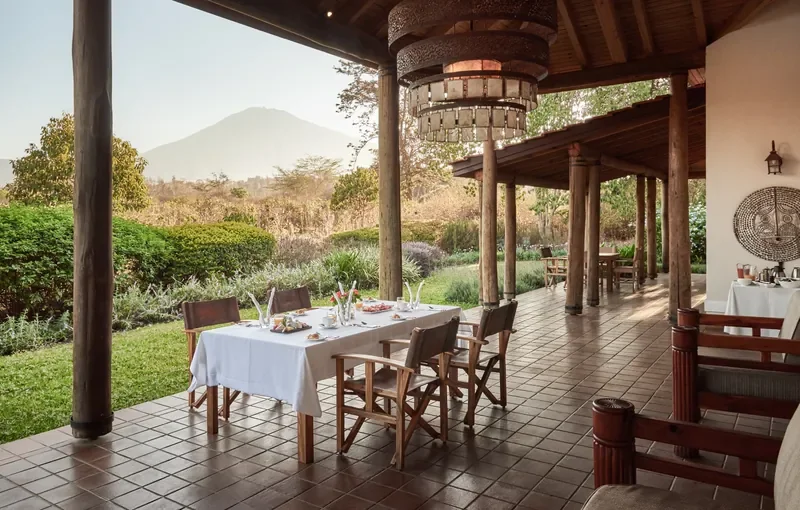 Private veranda dining at Legendary Lodge with Mount Meru view, Arusha breakfast outdoors