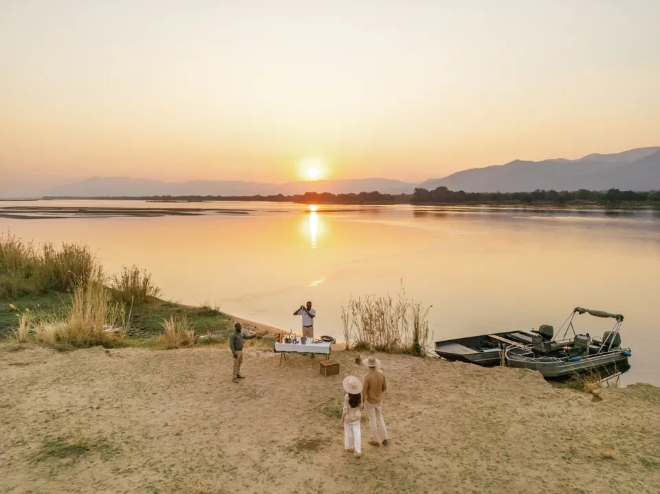 Island sundowners on the Zambezi River with boat access from Chongwe Camp, Lower Zambezi National Park, Zambia