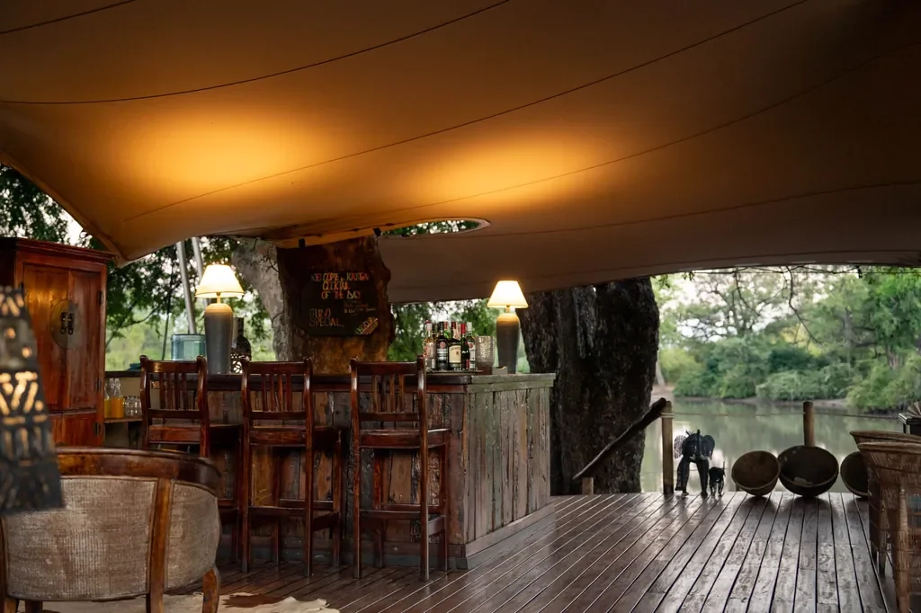 Kanga Expeditions bar under stretch tent by waterhole, Mana Pools Zimbabwe