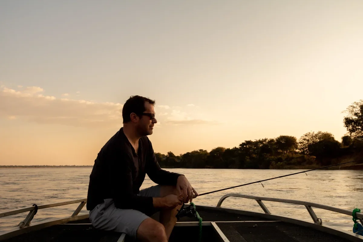Fishing at sunent on the Zambezi river in Southern Africa for Tiger fish