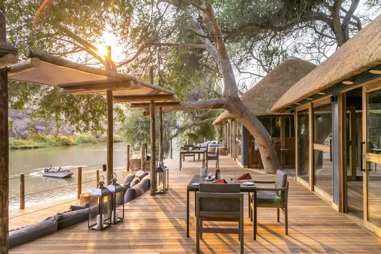 Serra Cafema main deck on the Kunene River with lodge boat cruise, Namibia