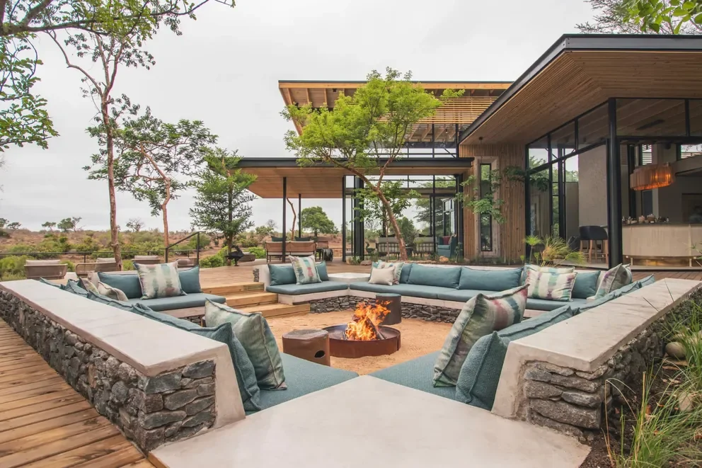 Fire deck at Lion Sands Ivory Lodge, Sabi Sand, Greater Kruger, South Africa with lanterns and sunken seating, ideal for starry-night boma evenings beside the Sabie River
