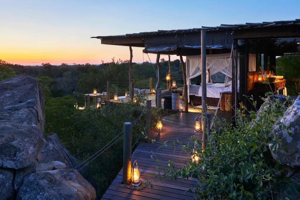 Kingston Treehouse elevated suite with canopy bed and lanterns, Lion Sands, Sabi Sand, Greater Kruger