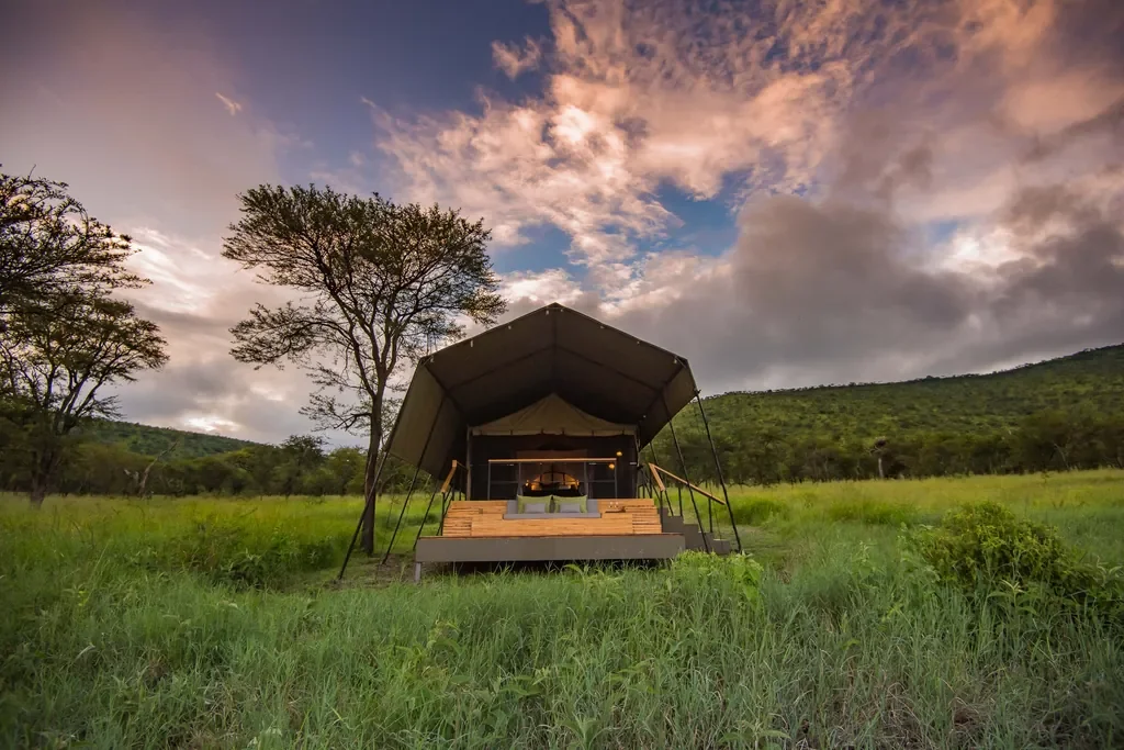 Dunia Camp guest tent exterior with new private deck set in the Serengeti grasslands