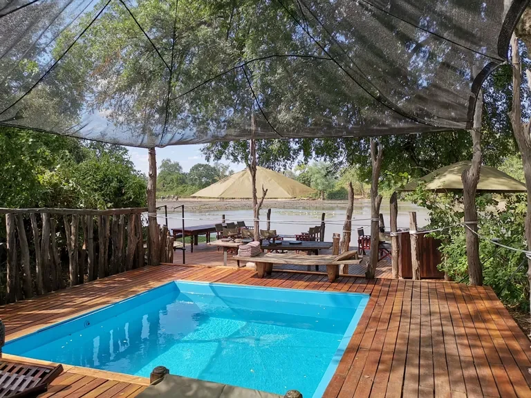 Kanga Expeditions plunge pool and shaded deck overlooking Kanga Pan, Mana Pools Zimbabwe
