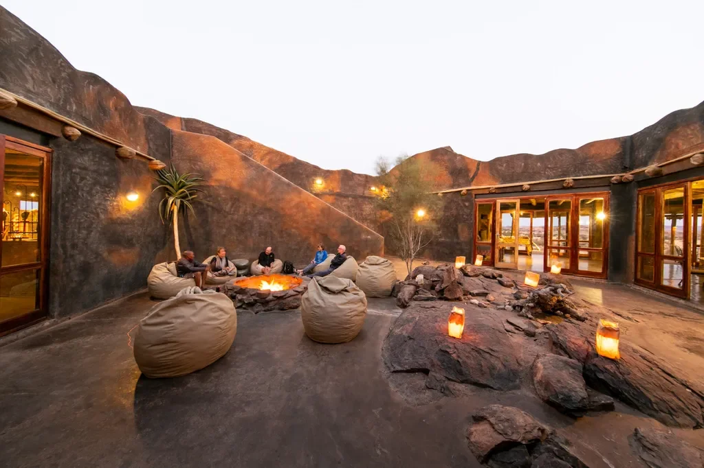 Courtyard fire pit gathering at Wilderness Doro Nawas lodge, Damaraland, Namibia