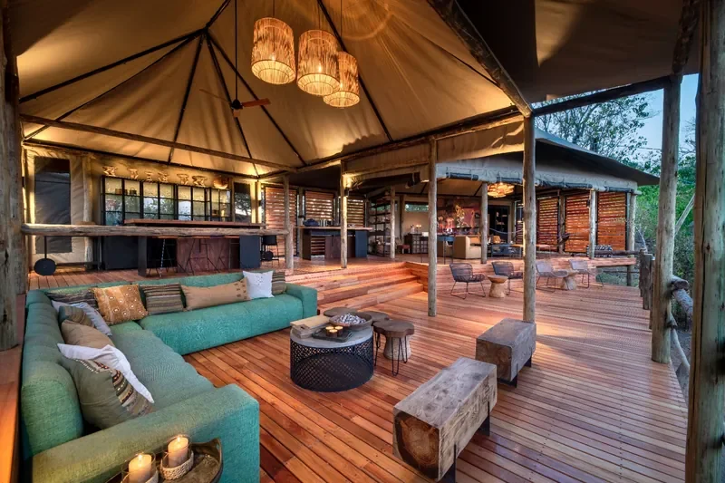 Khwai Lediba Expeditions Camp main lounge and bar, open-air deck overlooking Okavango Delta, Botswana