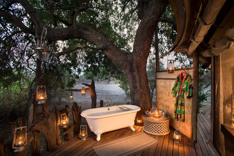 Outdoor bush bath with lanterns at Kanga Expeditions Mana Pools Zimbabwe