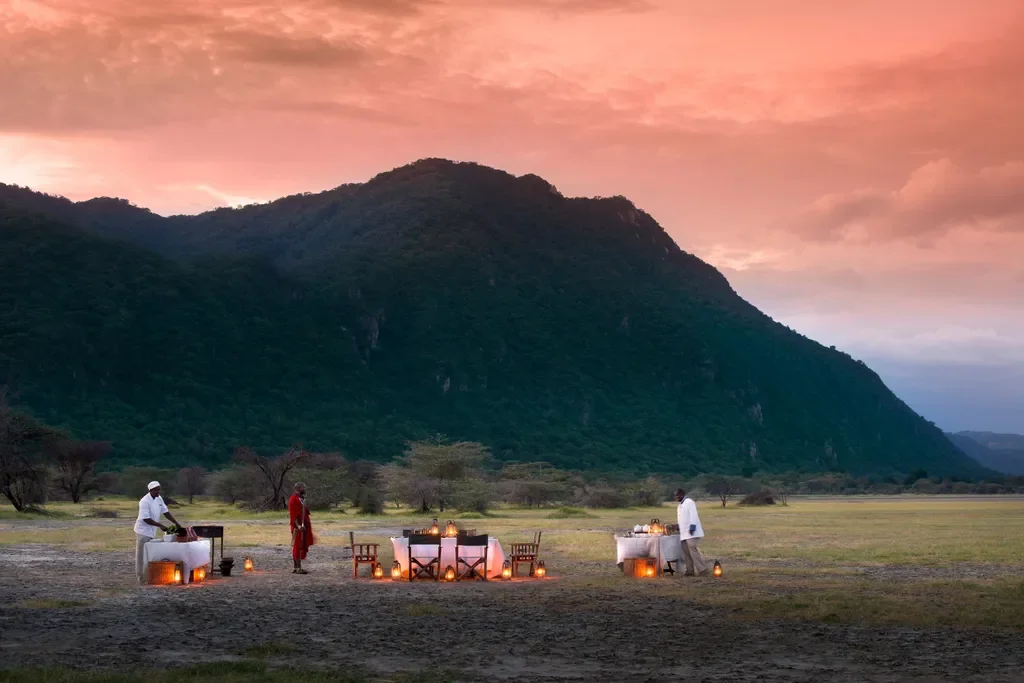 Lake Manyara Tree Lodge, Tanzania – private bush dinner with Rift Valley escarpment views at sunset