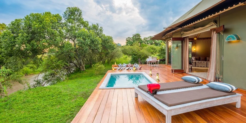 Timber sun deck with private plunge pool facing the plains — Sala’s Camp, Maasai Mara