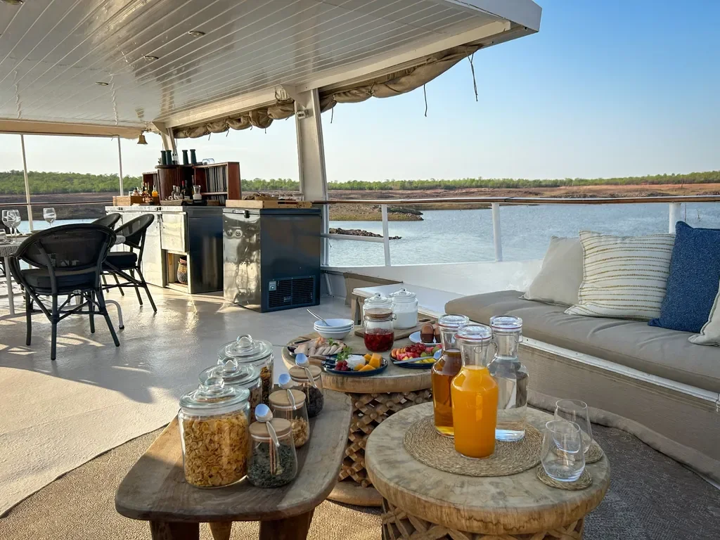 Morning juices and cereals beside the open-air bar on Lady Jacqueline houseboat, Lake Kariba, Zimbabwe