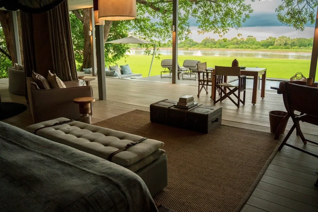 Spacious suite interior opening to Luangwa River views at Chinzombo, South Luangwa National Park, Zambia