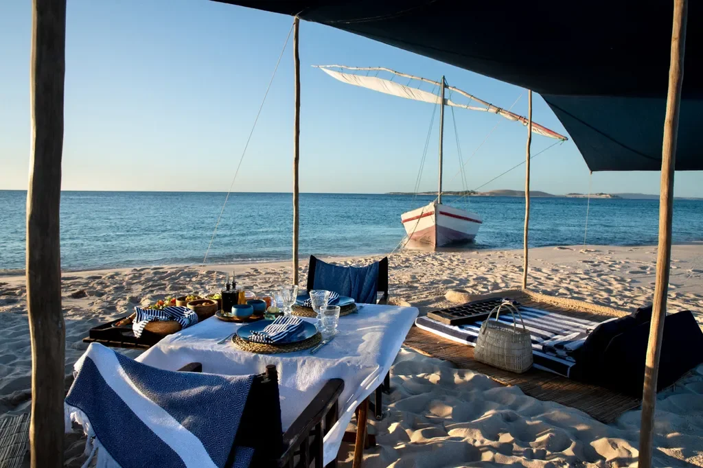 castaway picnic with dhow on remote sandbank – andBeyond Benguerra Island, Mozambique