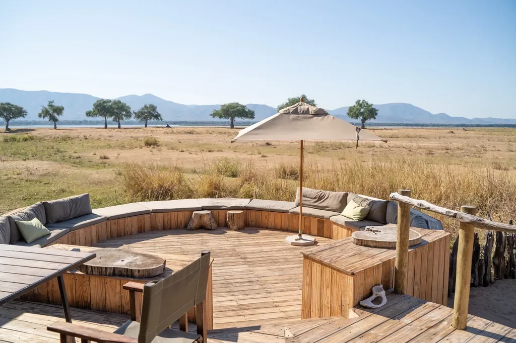 Boma firepit and circular seating at dusk, Nyamatusi Mahogany, Mana Pools, Zimbabwe