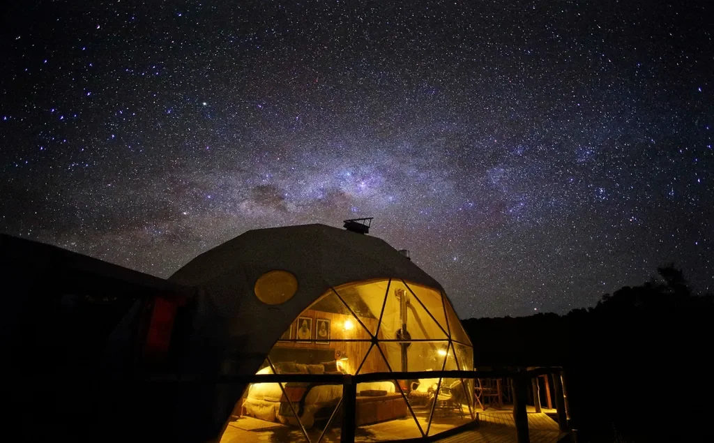 Star-filled night sky above The Highlands geodesic dome suite in Ngorongoro