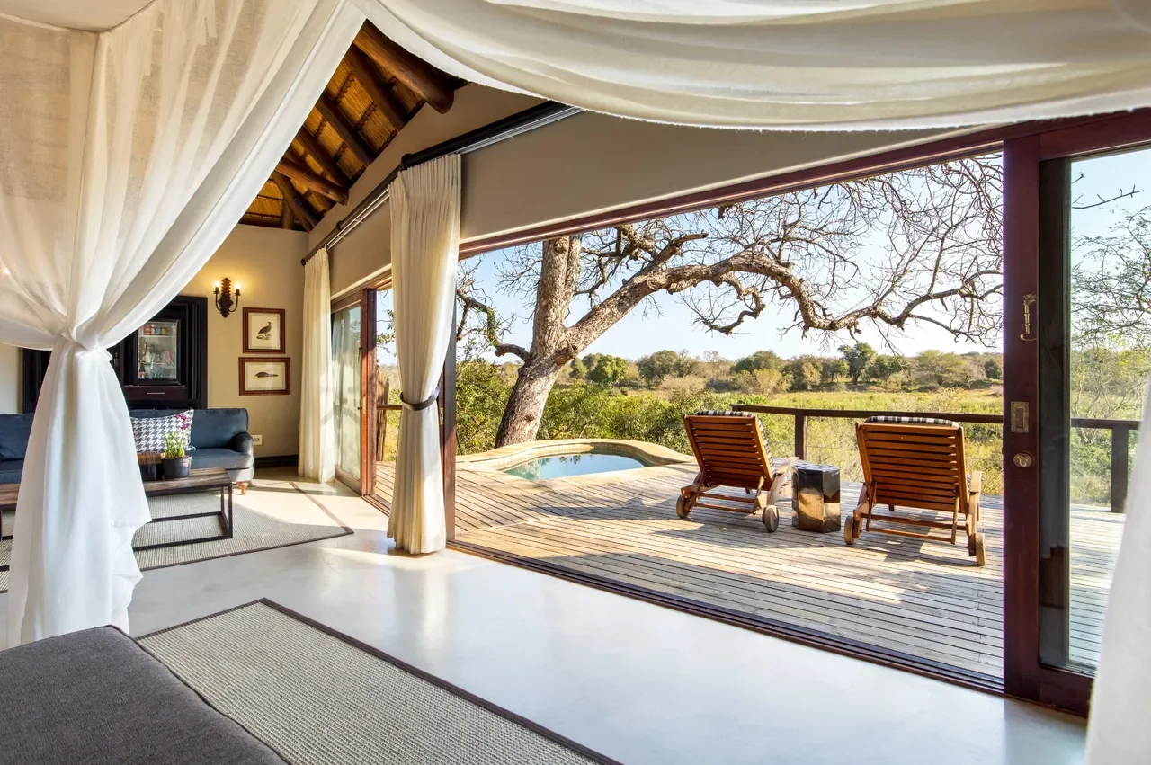Open-plan suite at Lion Sands Tinga Lodge with private plunge pool and panoramic bush views