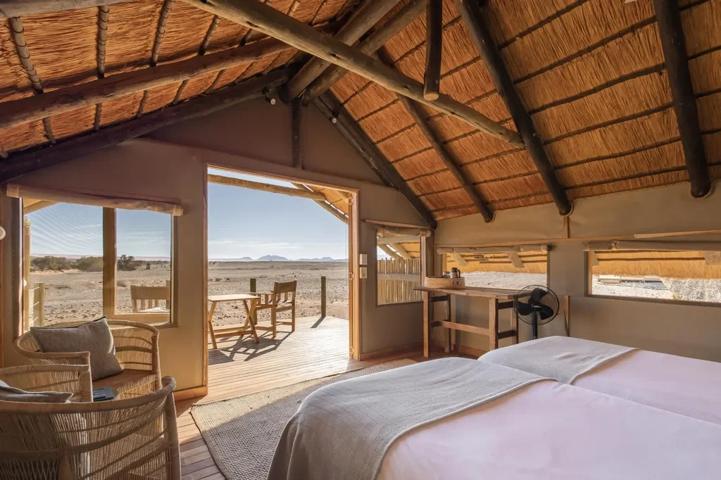 Kulala Desert Lodge tented suite interior with desert view deck in Sossusvlei, Namibia