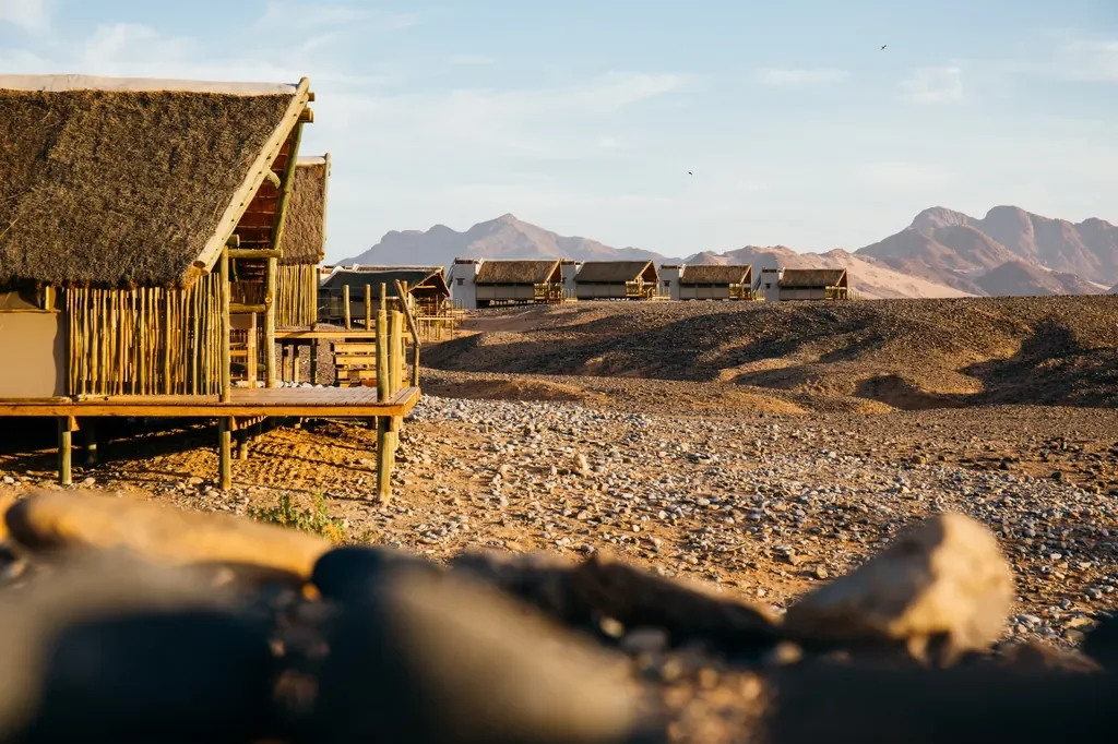Kulala Desert Lodge thatched desert chalets facing the Namib dunes near Sossusvlei