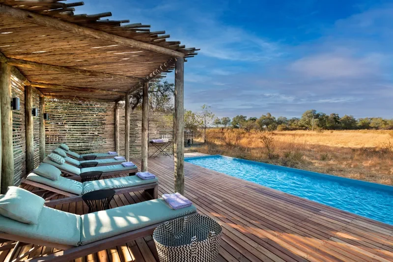 Relaxation pool and sun deck at Khwai Lediba Expeditions Camp, Okavango Delta, Botswana