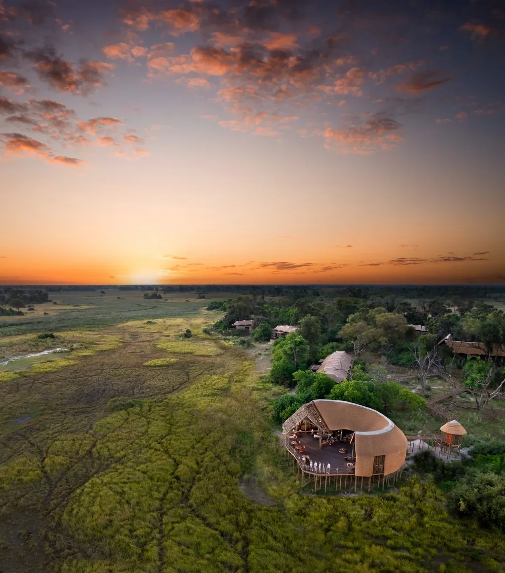 Sunset over Atzaro Okavango Camp main deck facing the Okavango Delta grasslands, Botswana