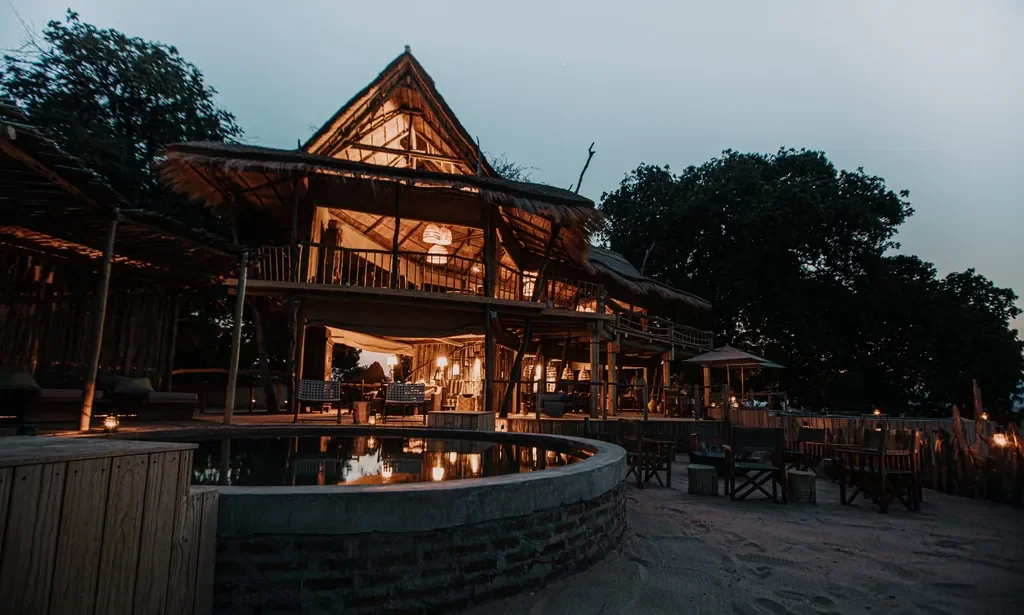 Two-storey main area beside circular pool at dusk, Nyamatusi Mahogany, Mana Pools, Zimbabwe