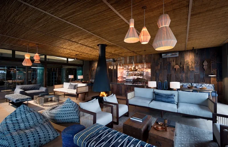 Stylish lounge and bar interior at Thorntree River Lodge, luxury safari lodge in Zambia