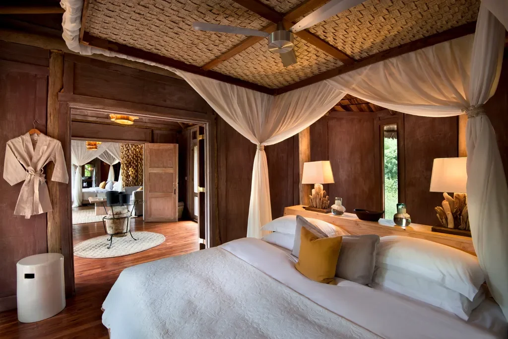 Lake Manyara Tree Lodge, Tanzania – family suite bedroom with canopy bed and natural textures